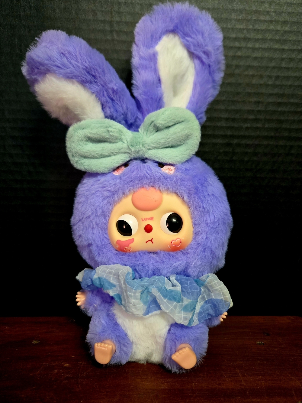 Plush toy is purple rabbit character named Sophie from the Baby Three Lily Rabbi